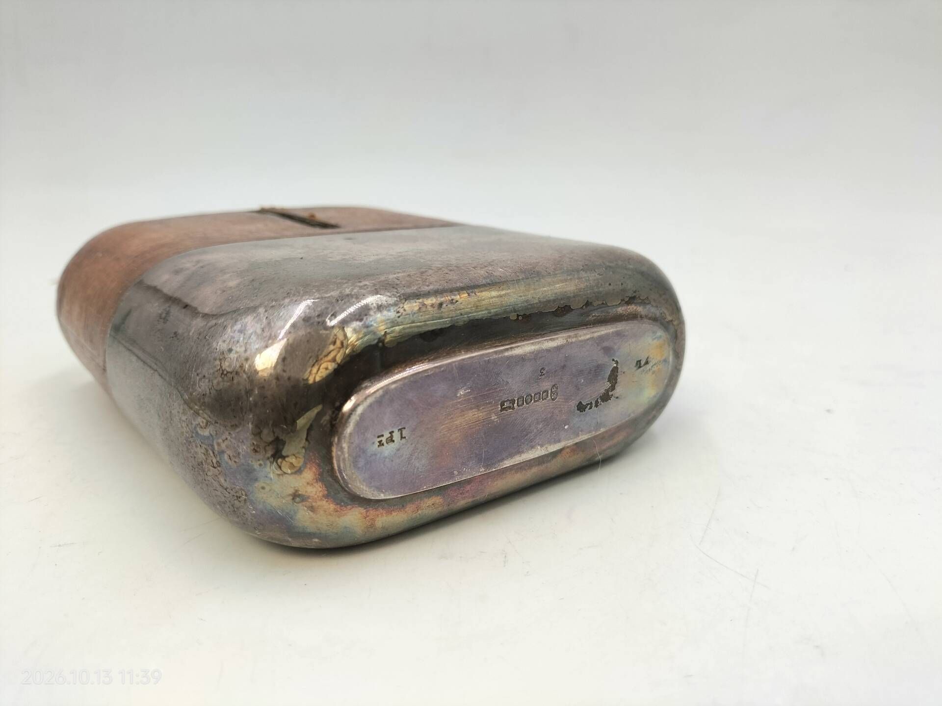 Silver-plated metal flask with leather and glass