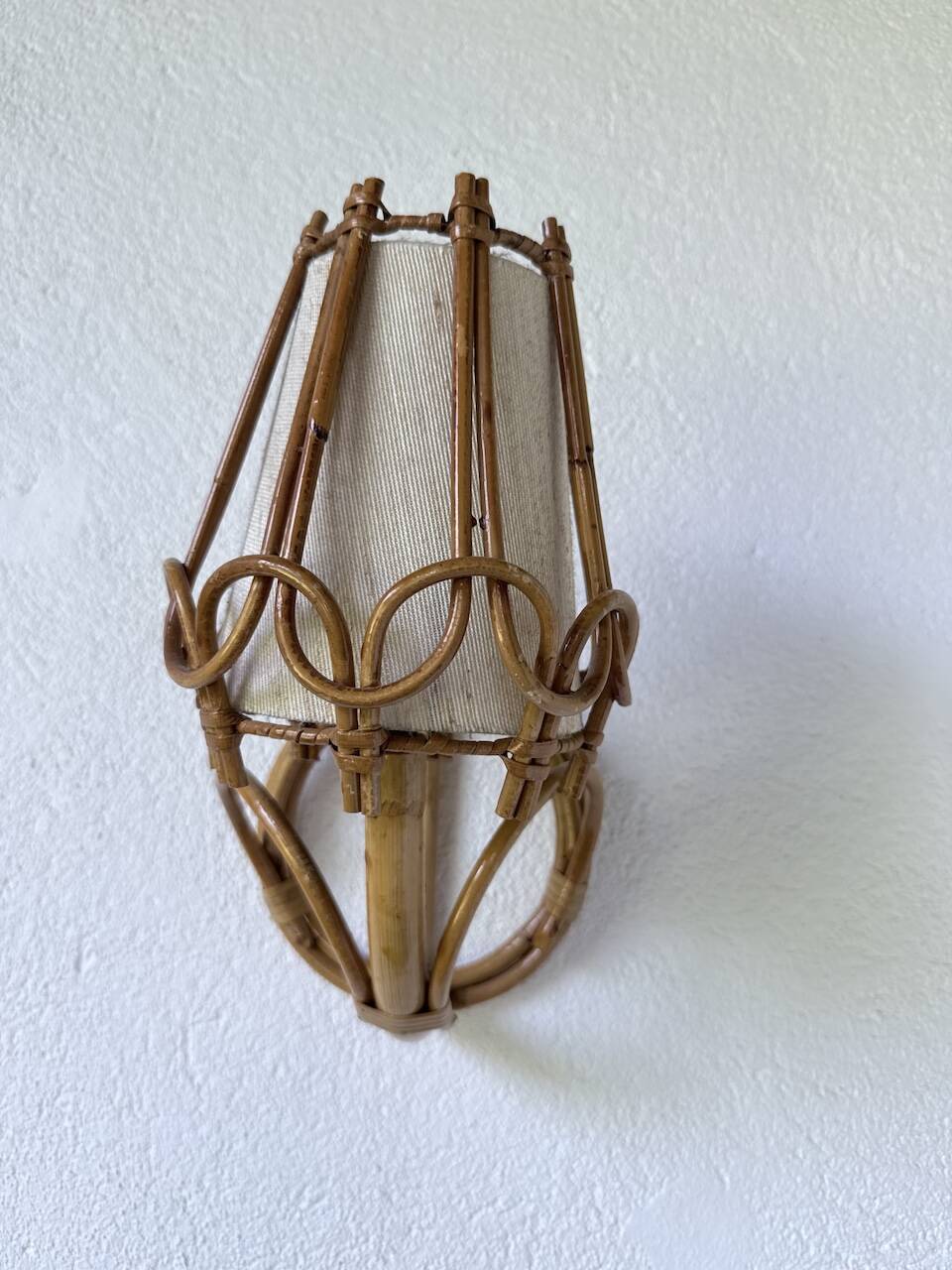 Pair of rattan wall lights by Louis Sognot, 1960.