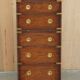 Pair of vintage military campaign high chests of drawers with leather tops.