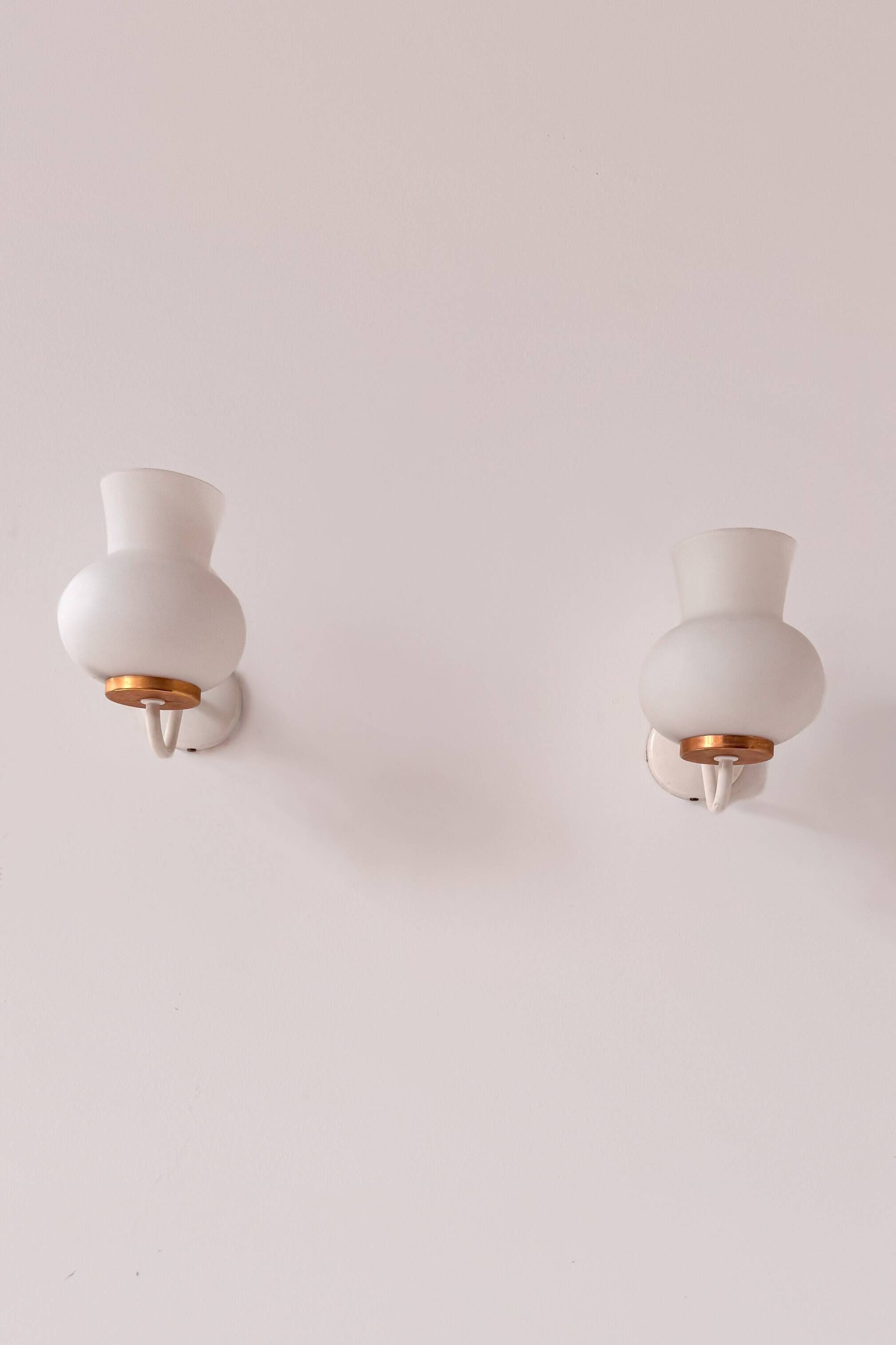 Pair of vintage wall lights in brass and opaline, France 1970.
