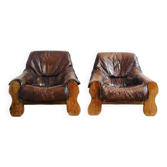 Pair of brutalist armchairs in leather and wood