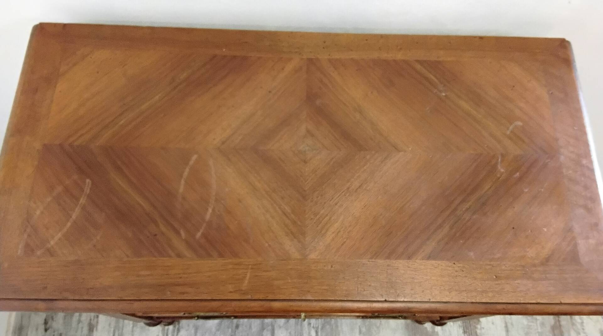 Antique marquetry commode in the Louis XVI style.