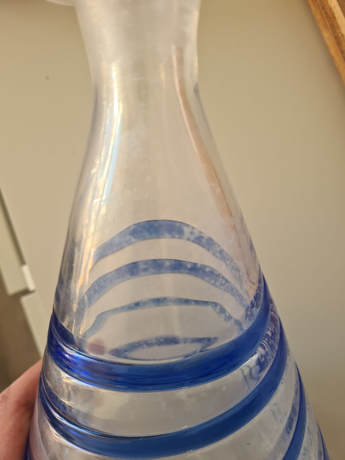 Conical glass vase/carafe blown with a blue spiral decoration.