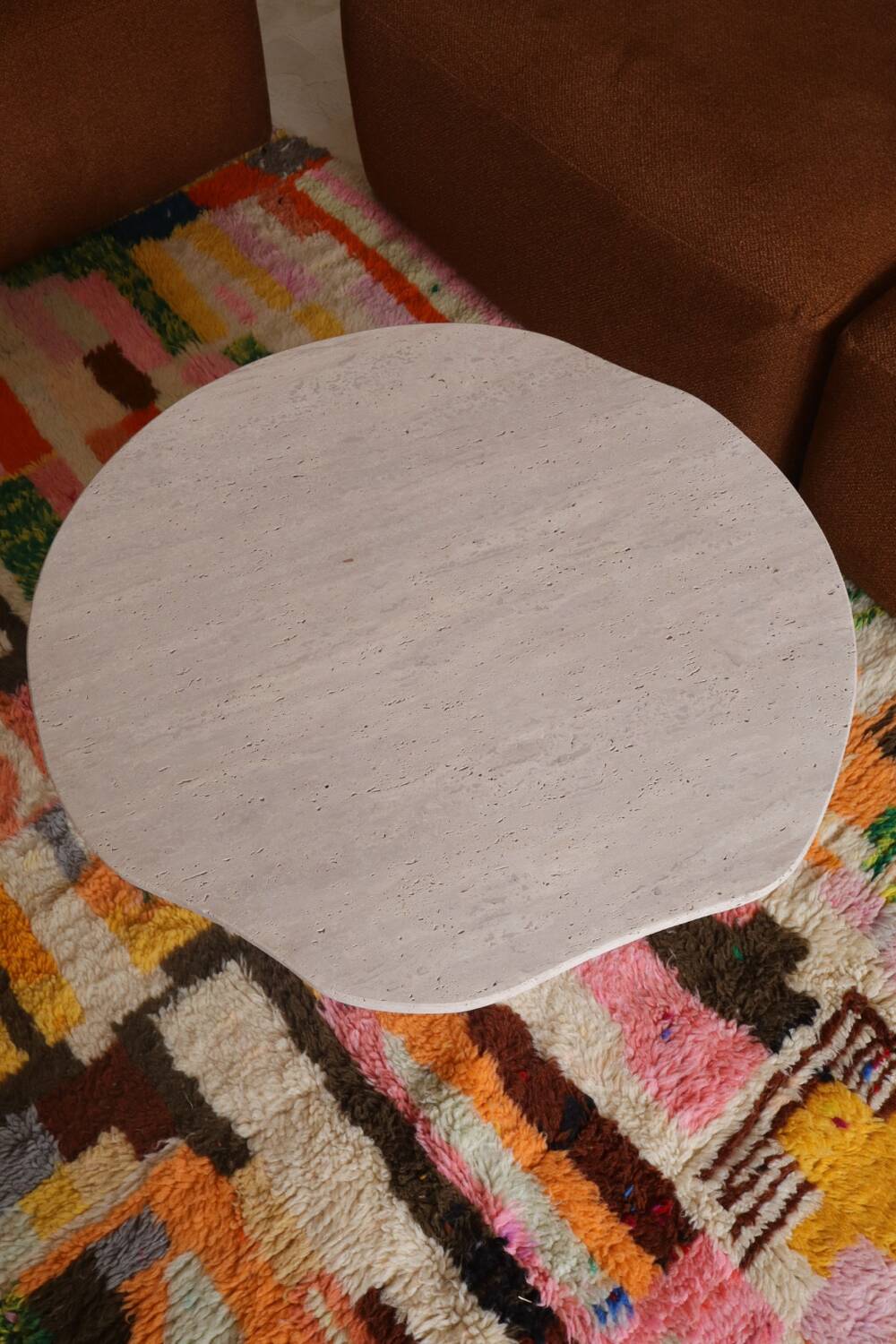 Organic shape travertine coffee table