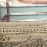 Beveled mirror in carved wood