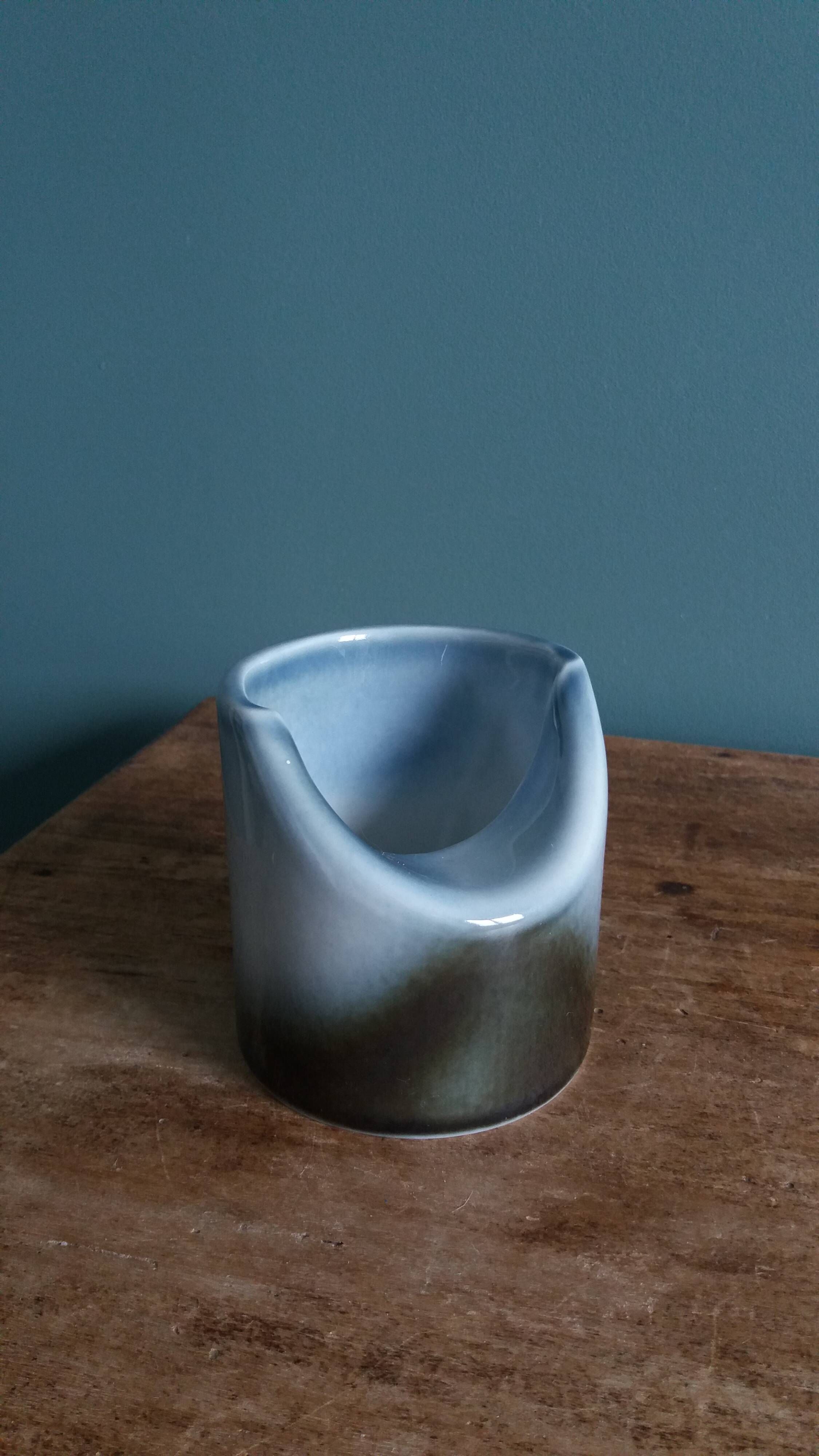Vase Virebent porcelain cylindrical roll shape with a deep neck.