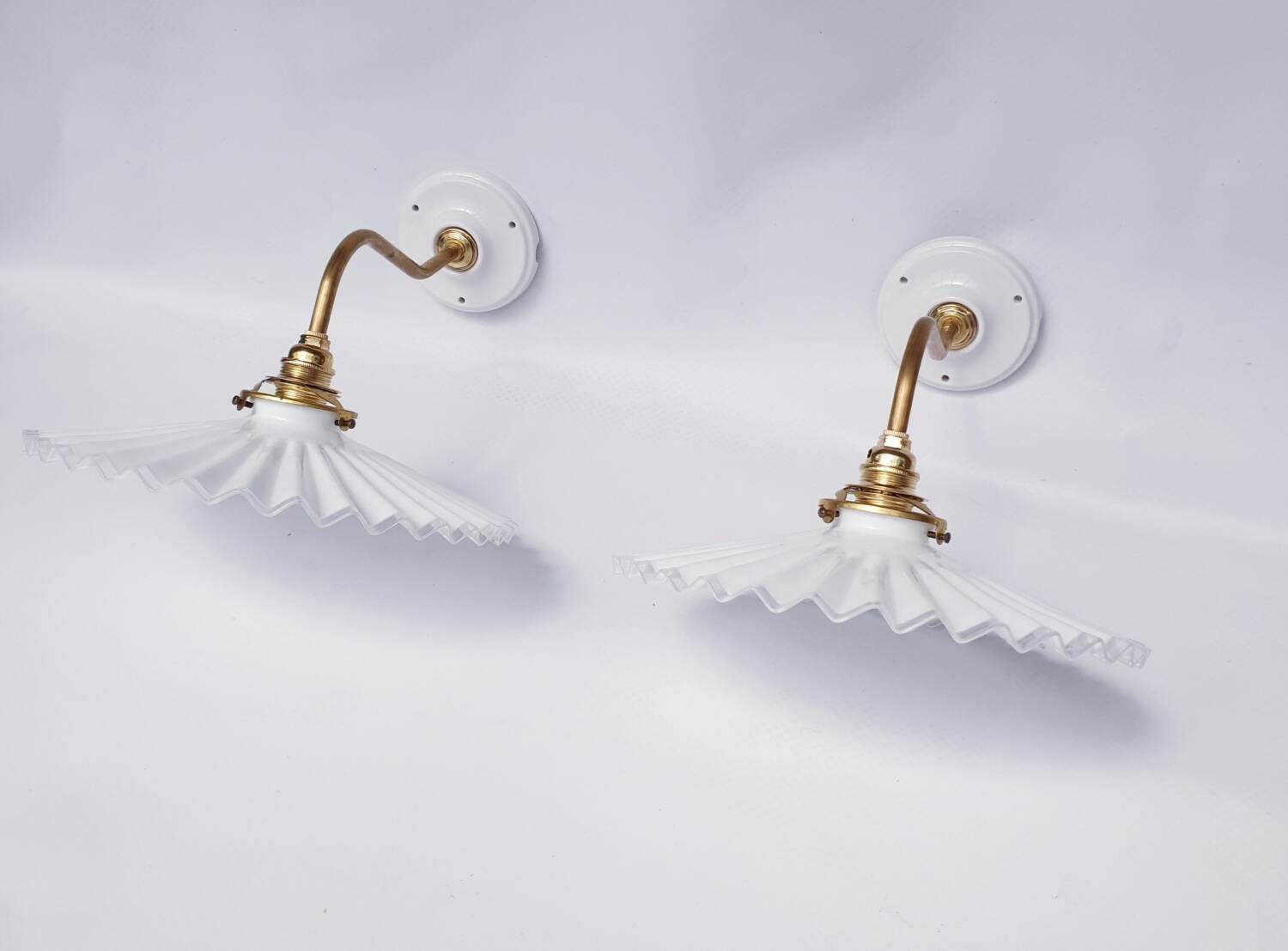 vintage wall lights in brass and pleated opal glass