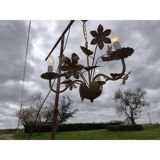 Vintage gold metal chandelier with floral decoration.