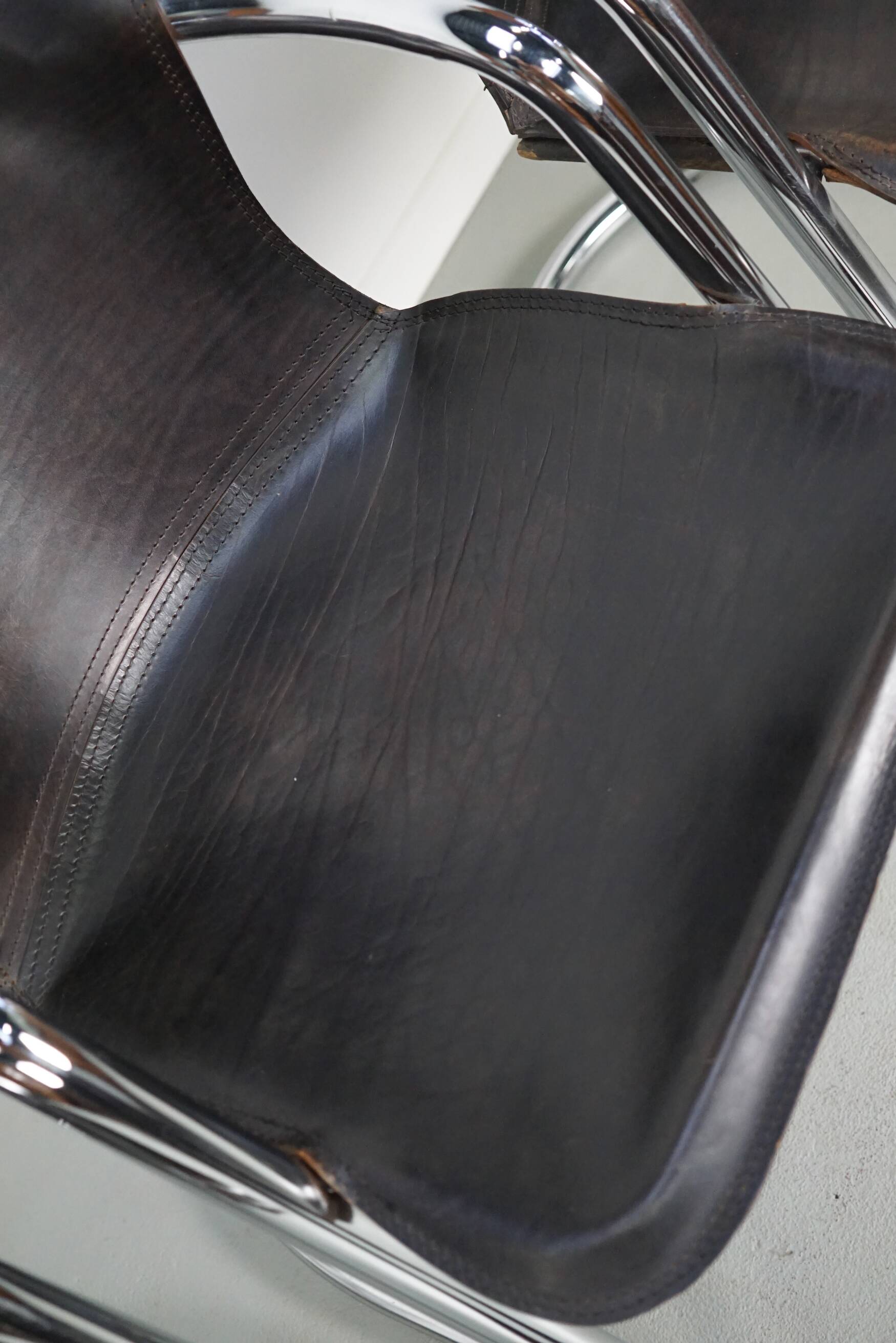 Set of four brown leather dining chairs, Willy Rizzo, 1970