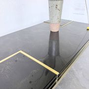 "Rizzo" lacquered and brass coffee-bar table from the 1970s.