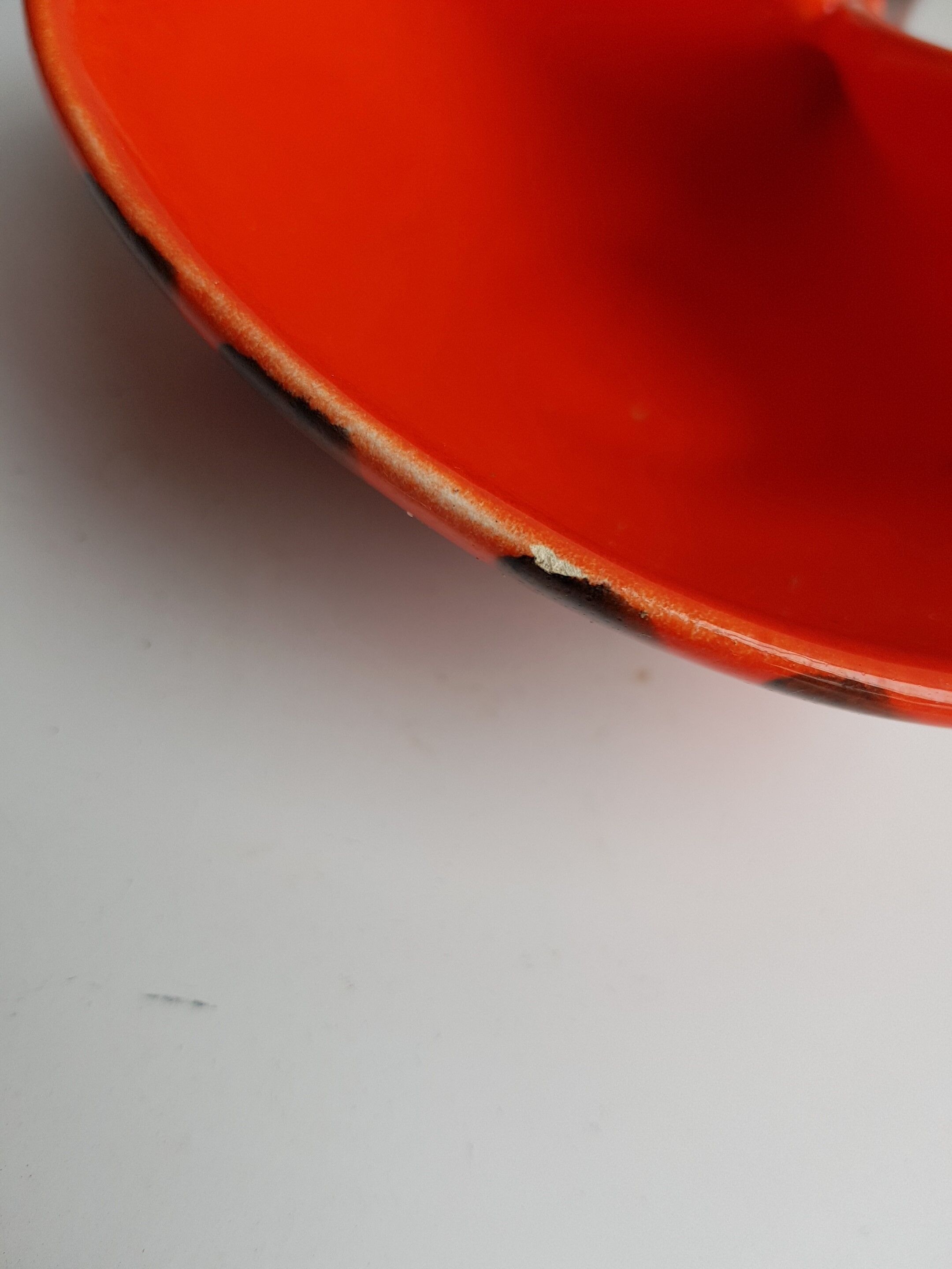 Empty orange enamelled pocket bird years 70