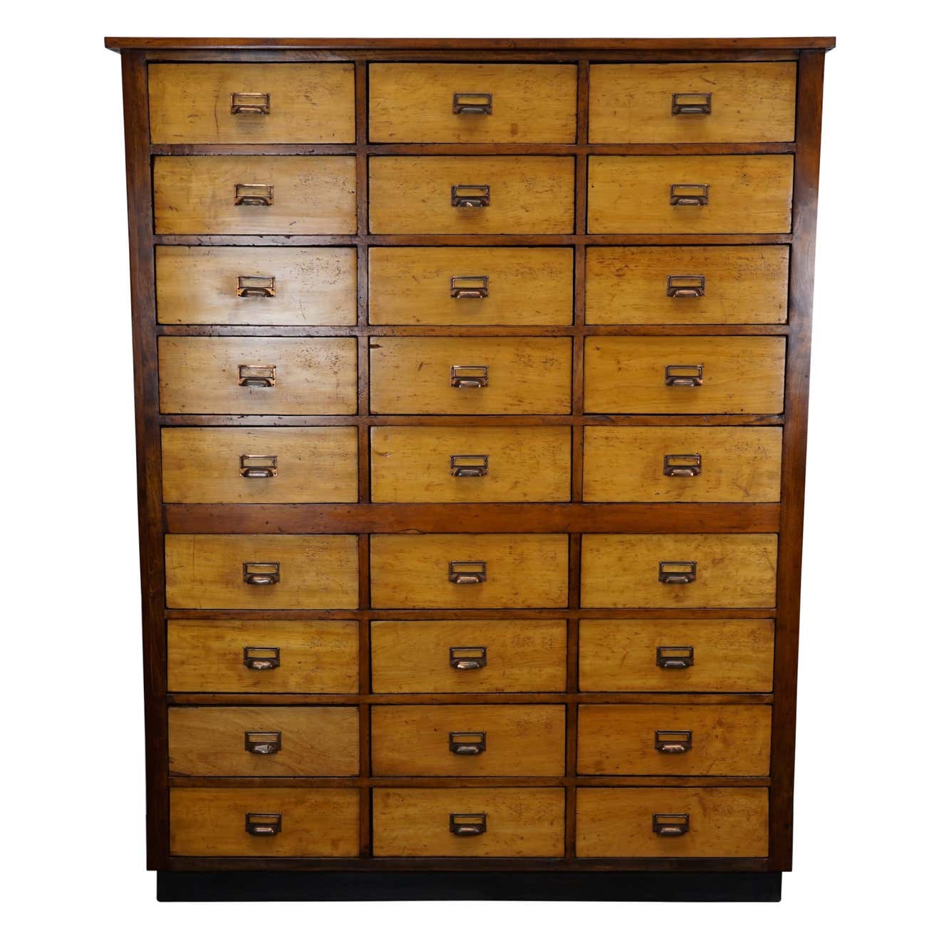 School cabinet bank of vintage Dutch drawers in mid-twentieth century pine