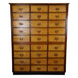 School cabinet bank of vintage Dutch drawers in mid-twentieth century pine