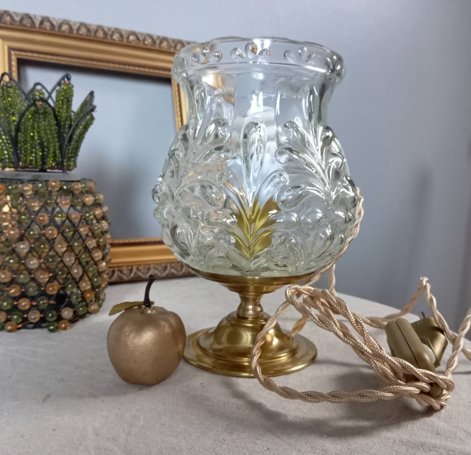 Brass foot table lamp, transparent textured molded globe, art deco style