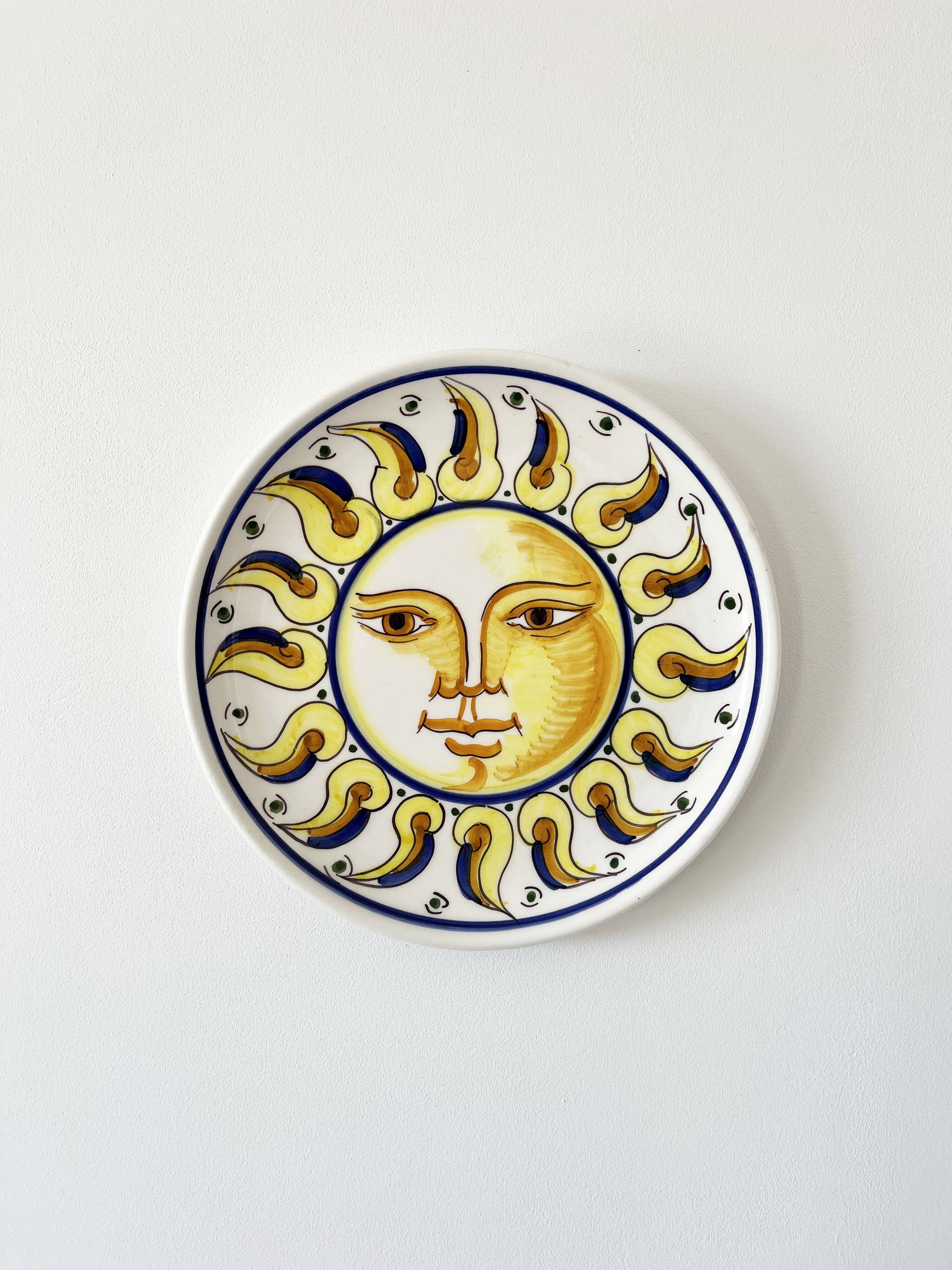 Decorative ceramic plate with sun face
