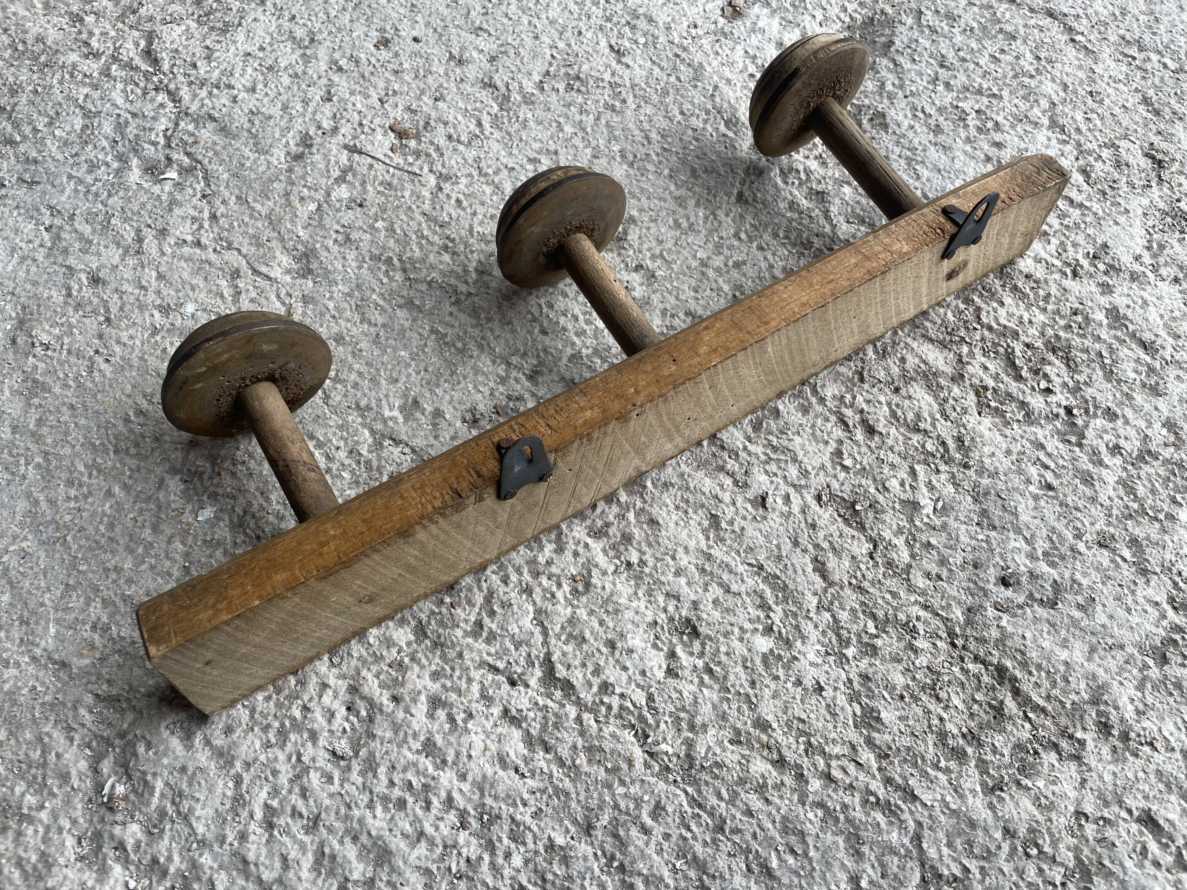 Old wooden wall coat rack