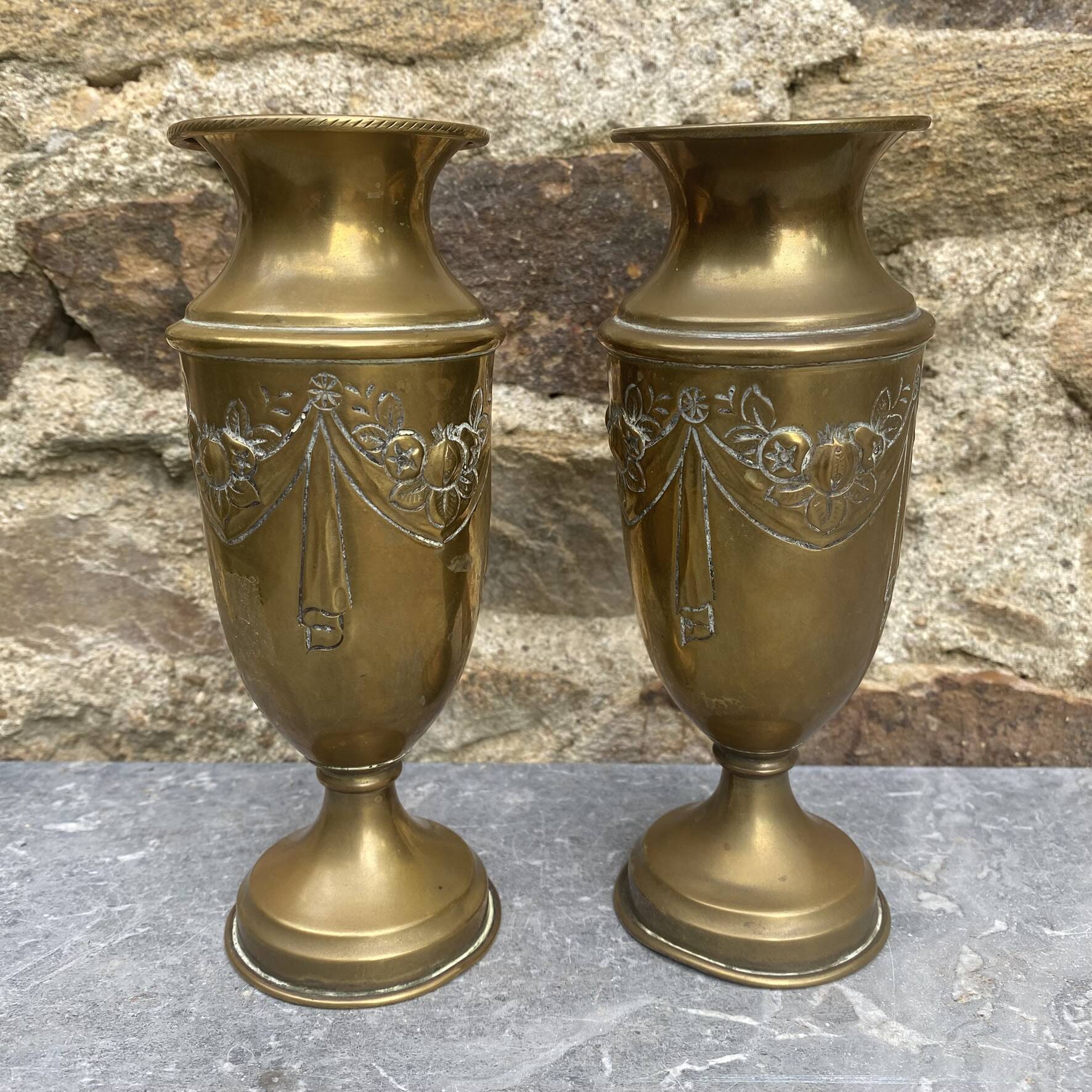 Pair of embossed brass bud vases stamped 17 cm