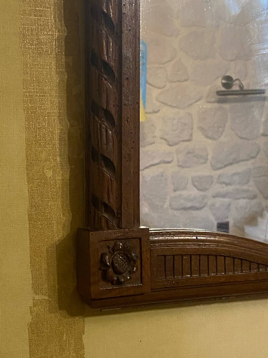 Carved wooden mirror in Louis XVI style