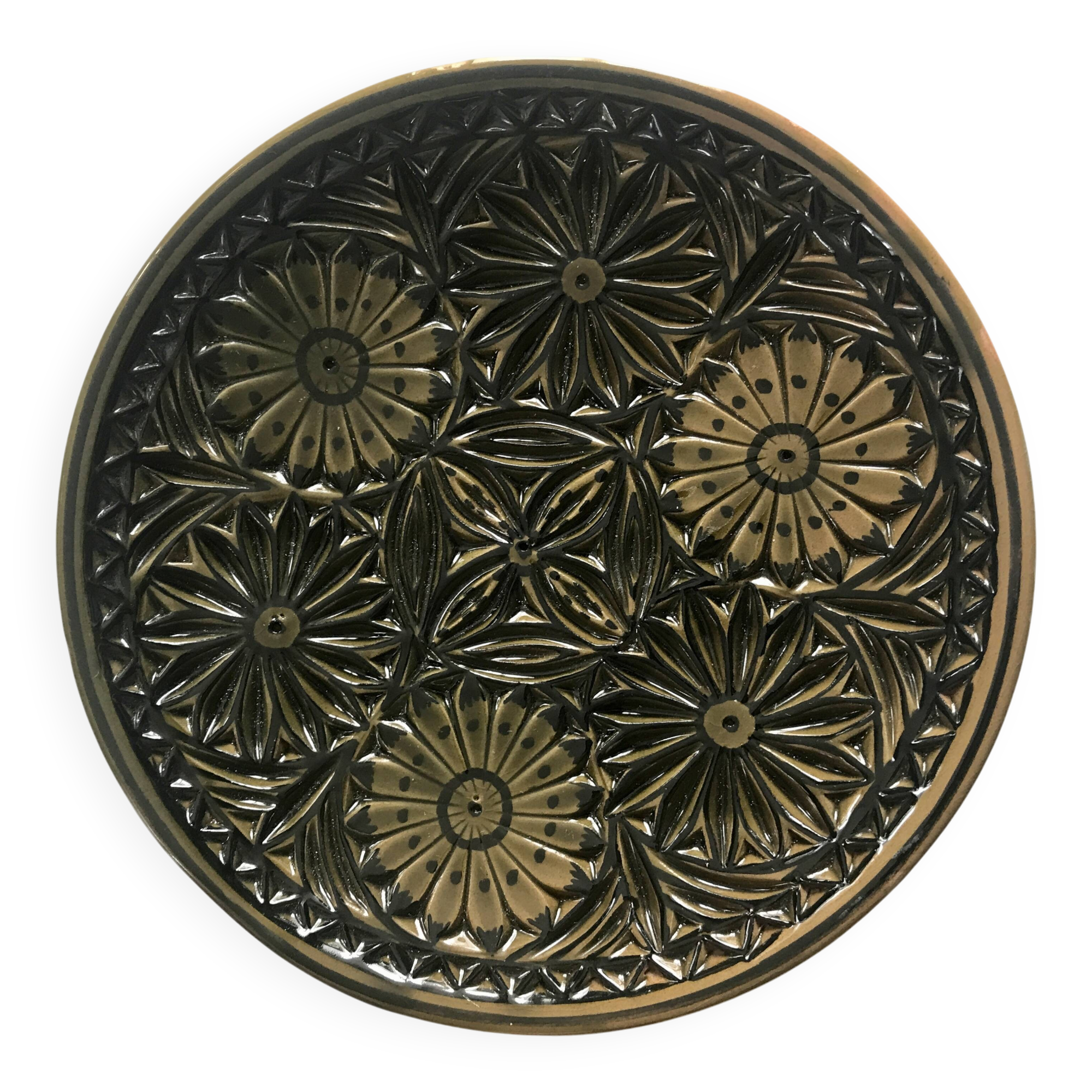 Small decorative chiseled ceramic plate