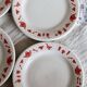 4 vintage porcelain dessert plates with red border and breakfast motif
