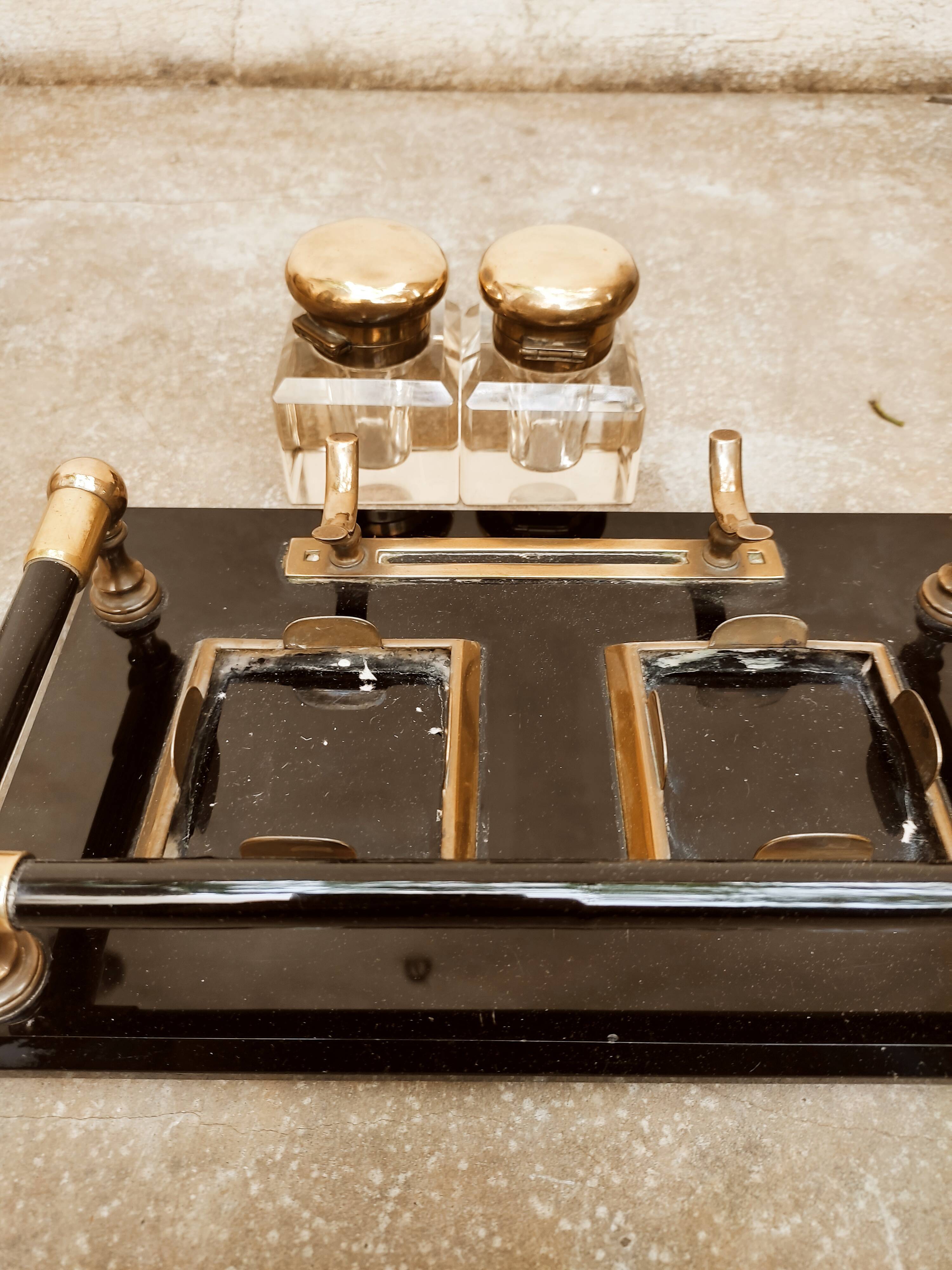 Hence the art deco inkwell on jet plate brass finishes
