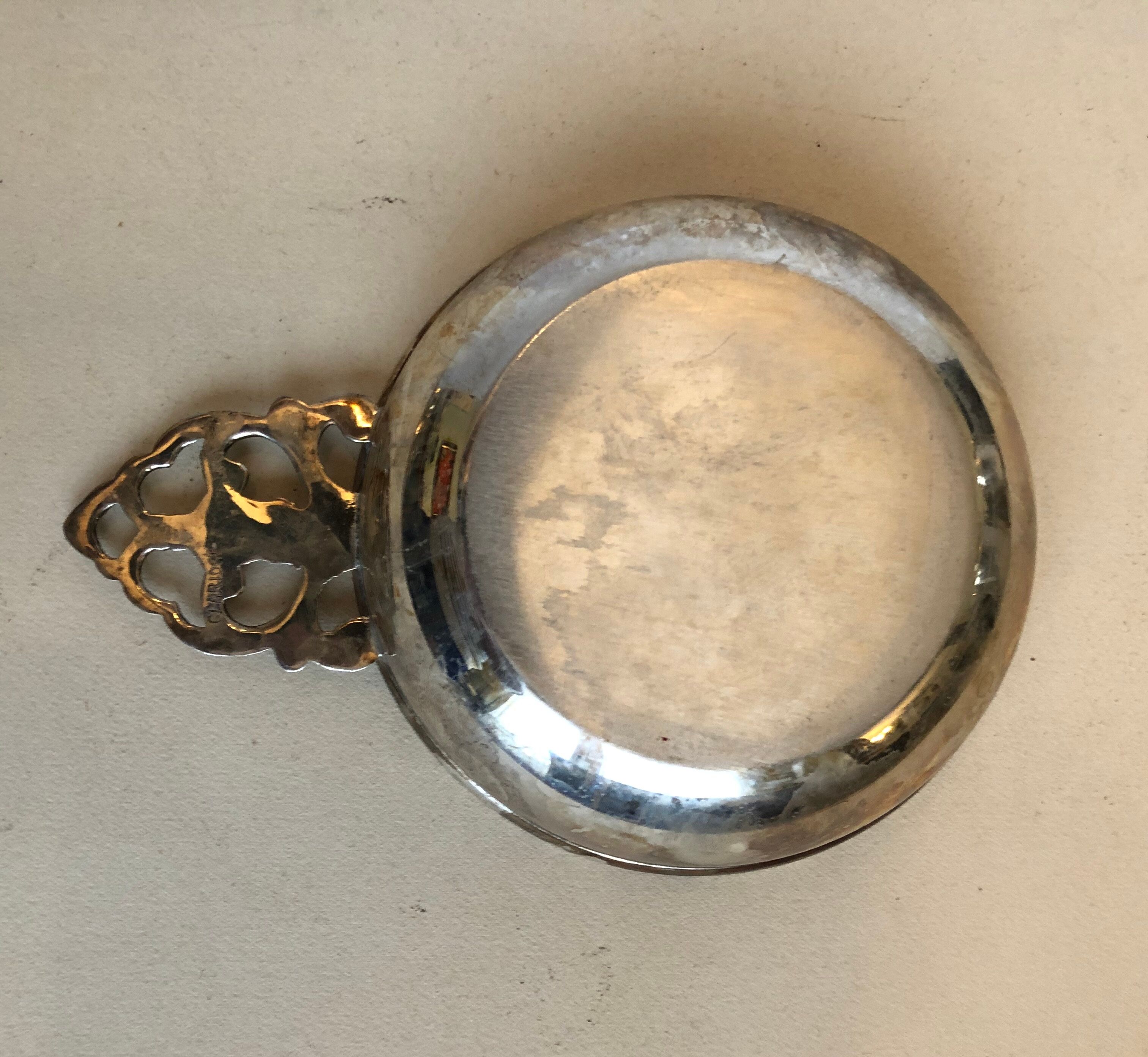 Silver metal tastevin