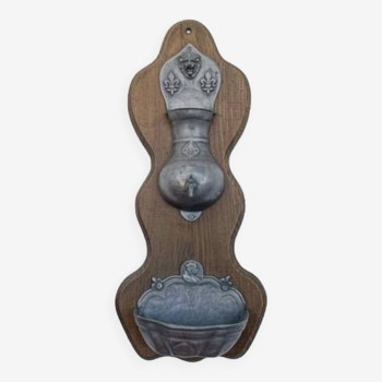 Pewter wall fountain on wooden base