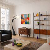 Small vintage 1950s wooden buffet with marble top and tapered legs.