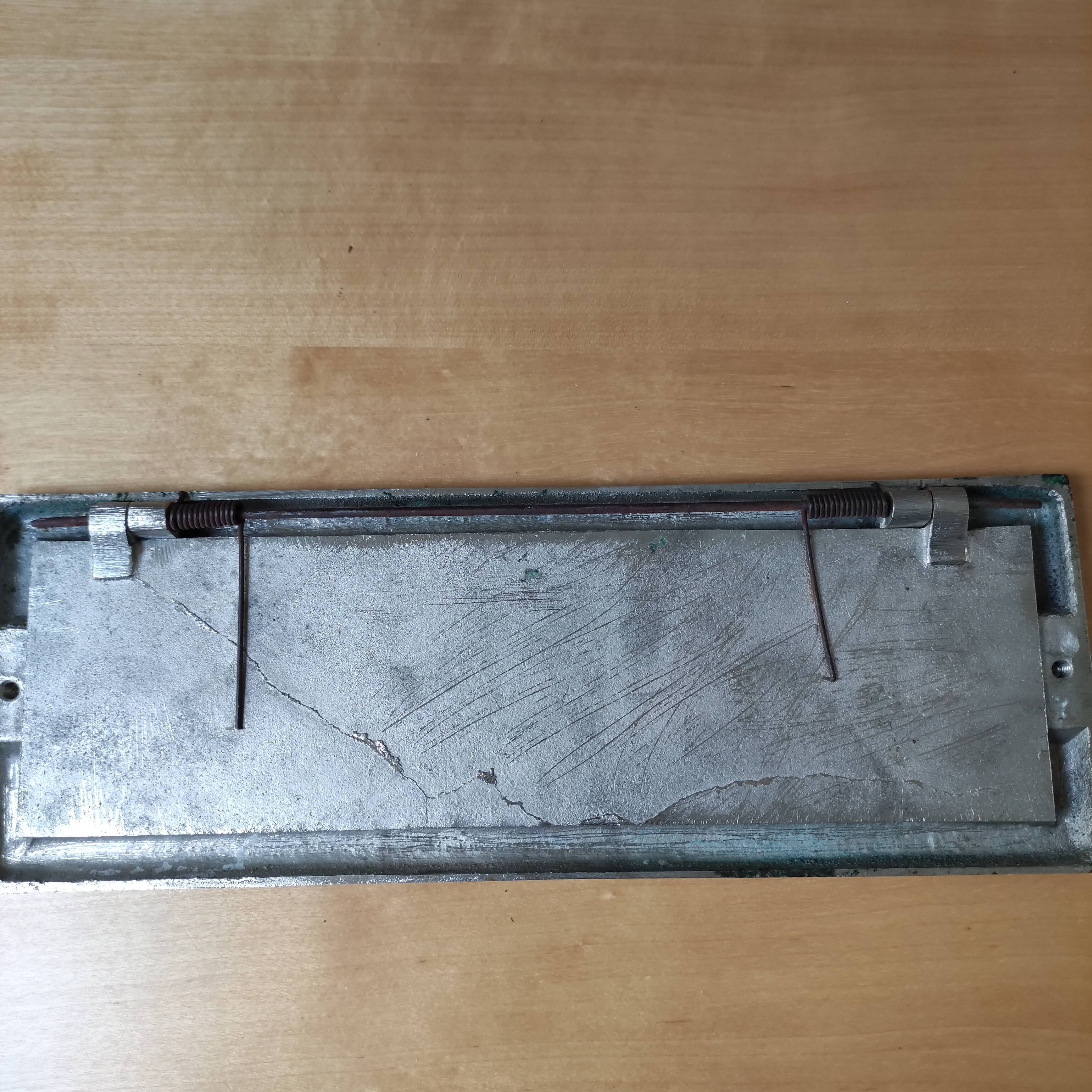 Sign "Printed"old. Silver metal.