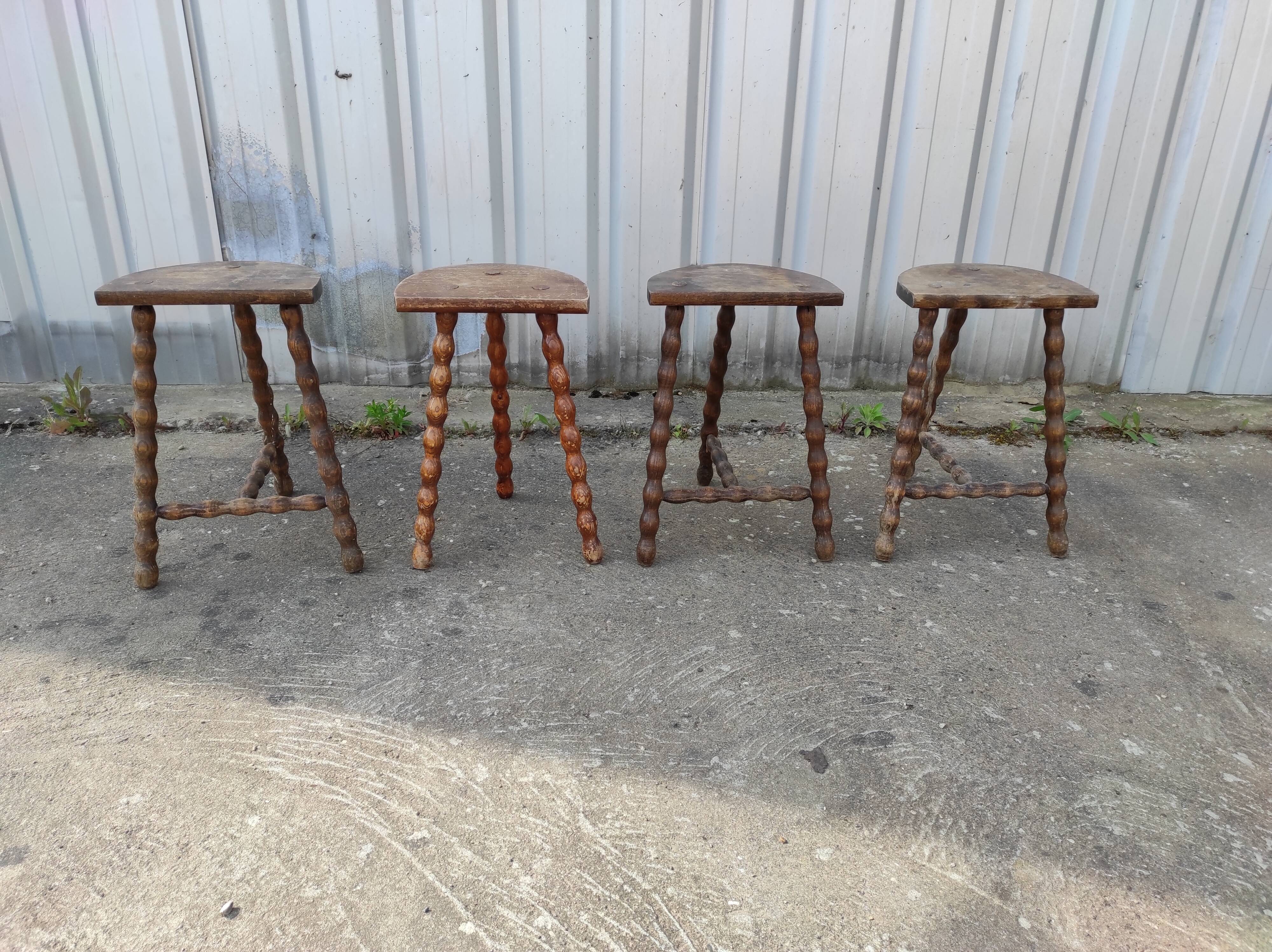 Lot 4 twisted wood tripod stools
