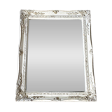 Beveled mirror in carved wood