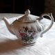 Musical teapot in white porcelain with floral decoration