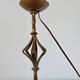 Large "Arts & Crafts" style lamp in beaten iron with a golden patina.
