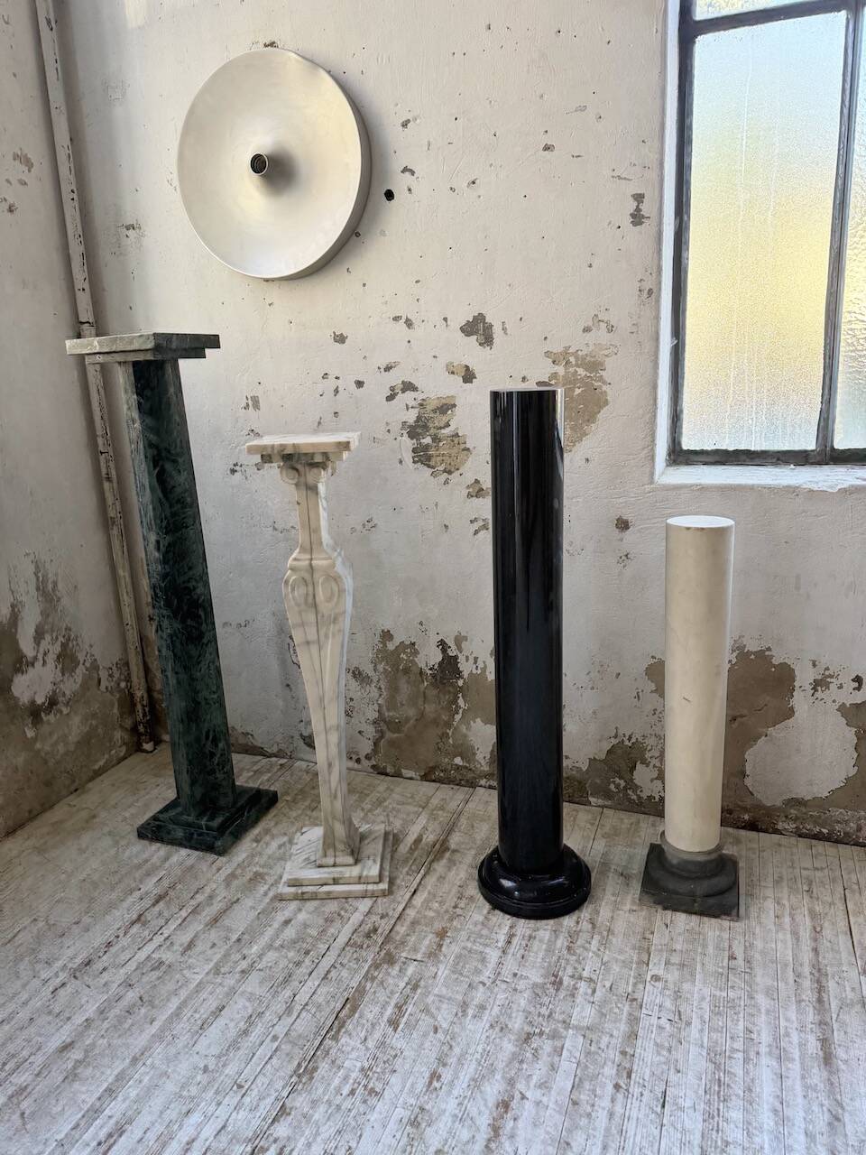 Set of 4 marble columns or pedestals.