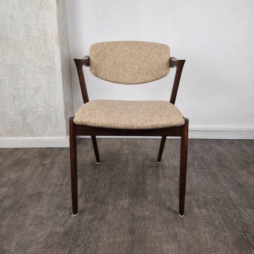 Rosewood and wool chair, model 42 by Kai Kristiansen for Korup Stolefabrik, Denmark, 1956.