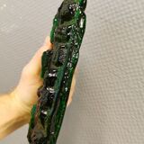 Old wall lamp made of hard pressed green glass.