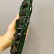 Old wall lamp made of hard pressed green glass.