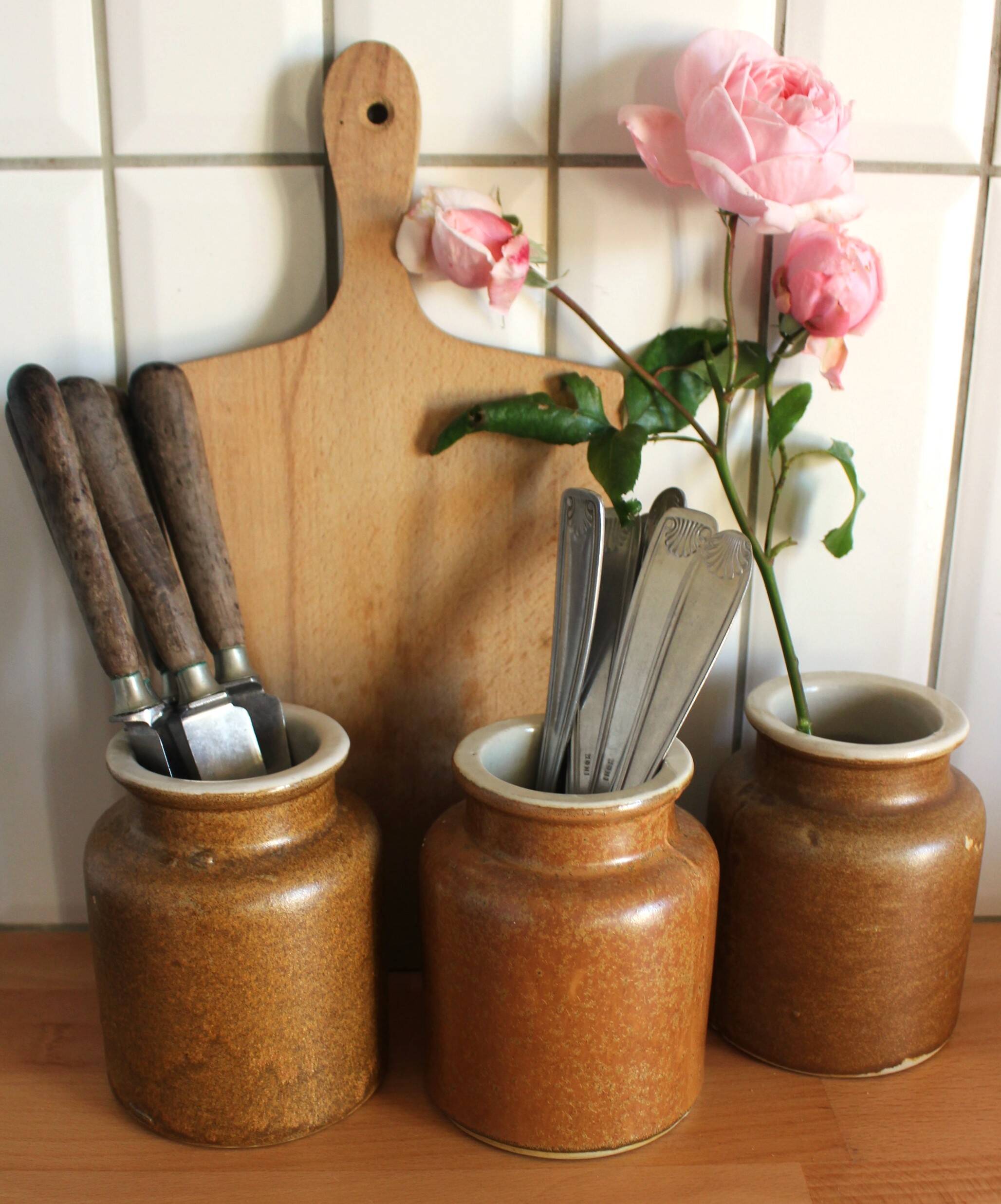 A set of 3 vintage glazed stoneware vases for indoor use.