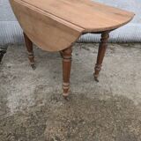 Round table with folding sides