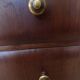 Antique chest of drawers from the 50s with 5 curved drawers, vintage old-style assembly and brass knobs