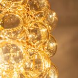 Large amber bubble glass pendant by Helena Tynell for Limburg, Germany, 1970s.