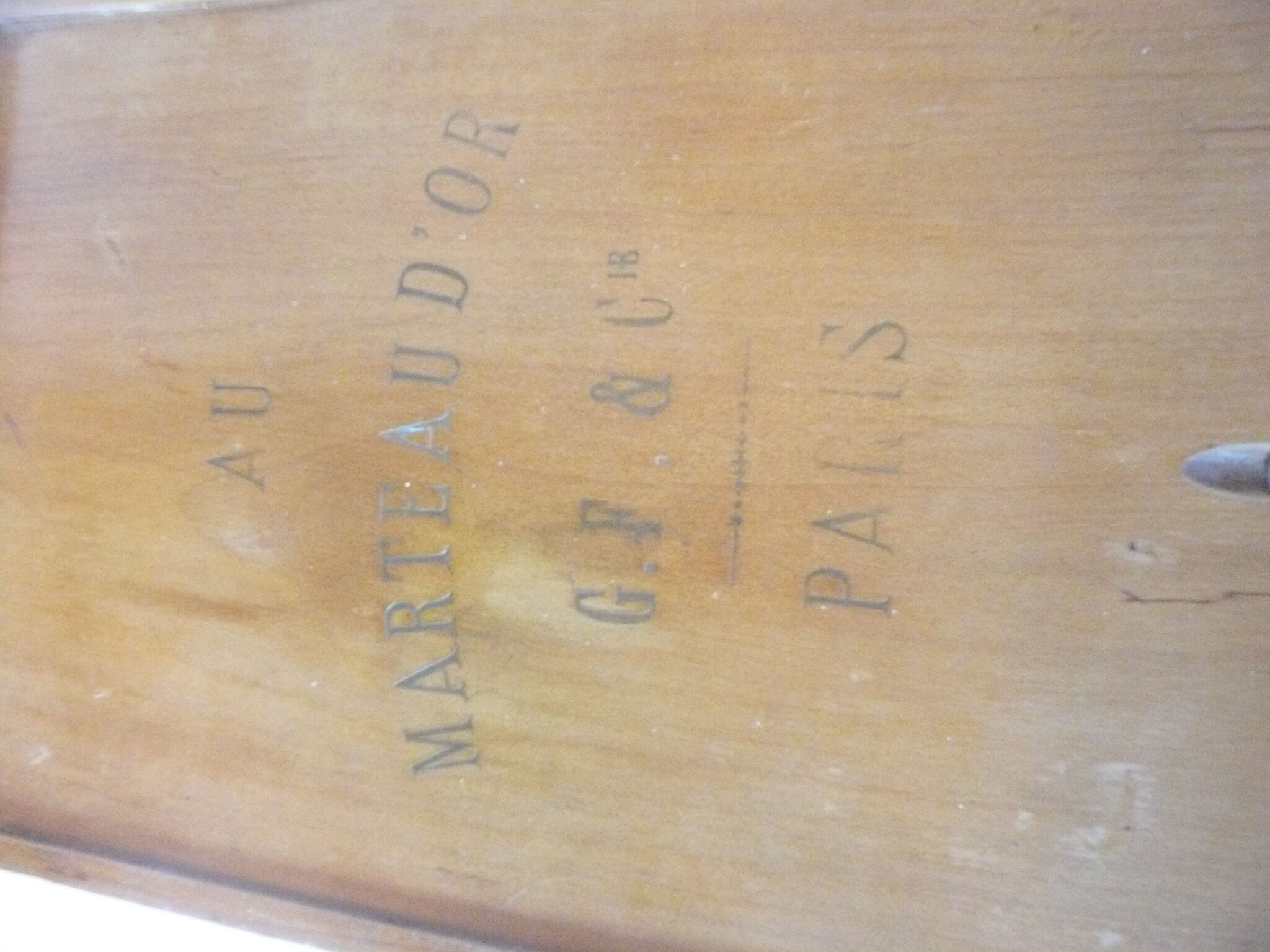 Wooden storage box marked "with a golden hammer"