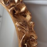 Old mirror in gilded wood late nineteenth