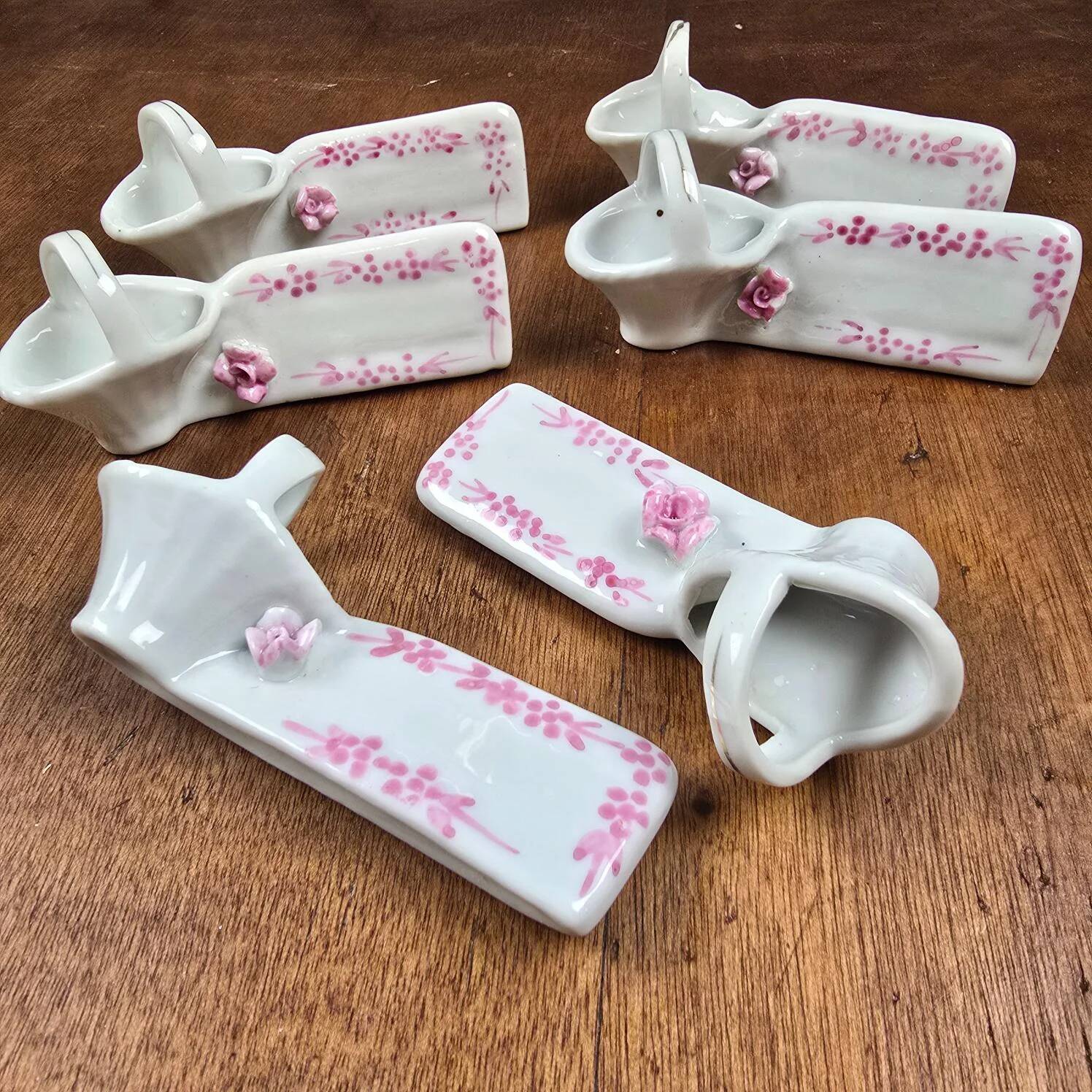 Set of 6 vintage porcelain knife rests with name markers, basket shape.