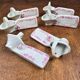 Set of 6 vintage porcelain knife rests with name markers, basket shape.