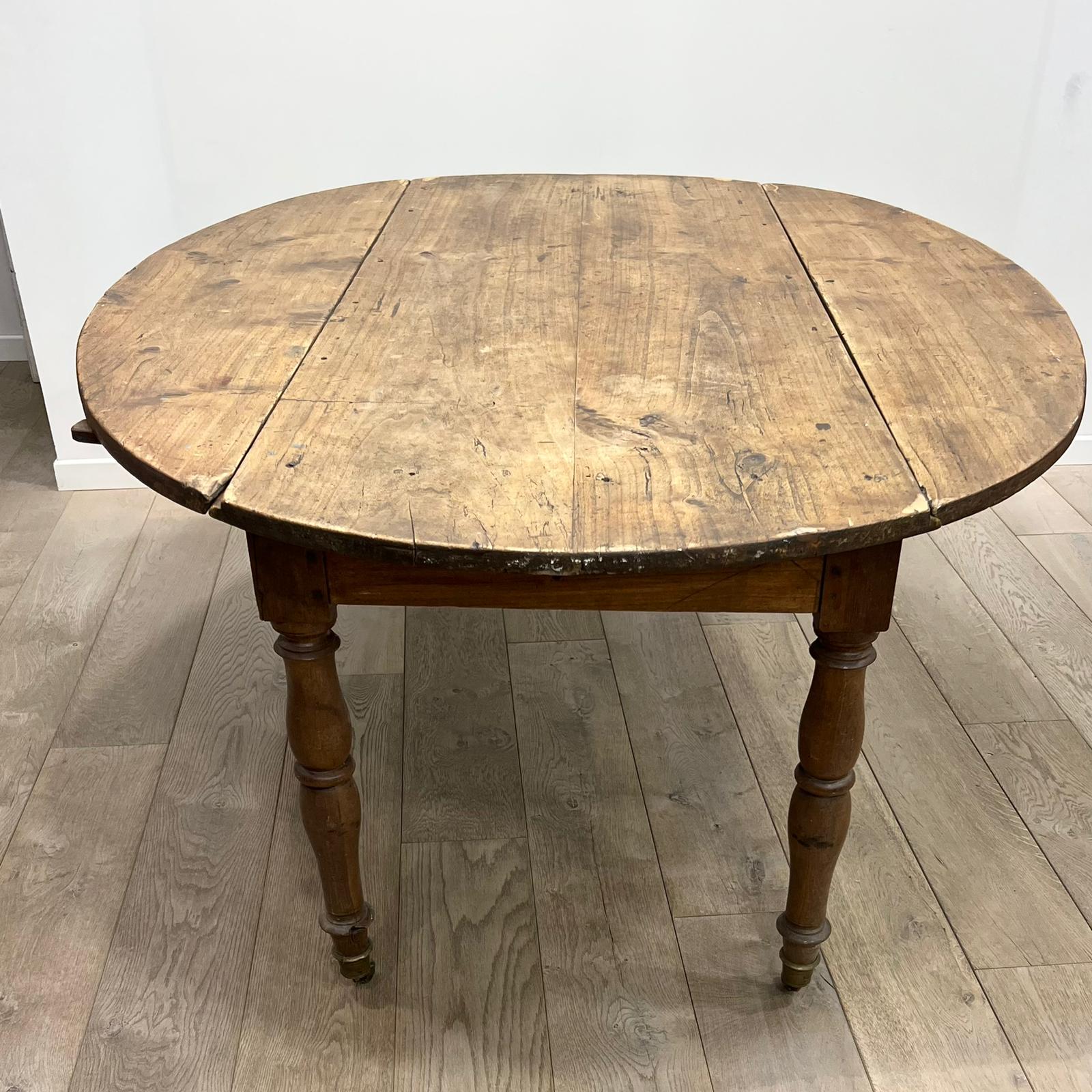 Louis Philippe wood dining table with shutters and casters
