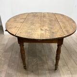 Louis Philippe wood dining table with shutters and casters