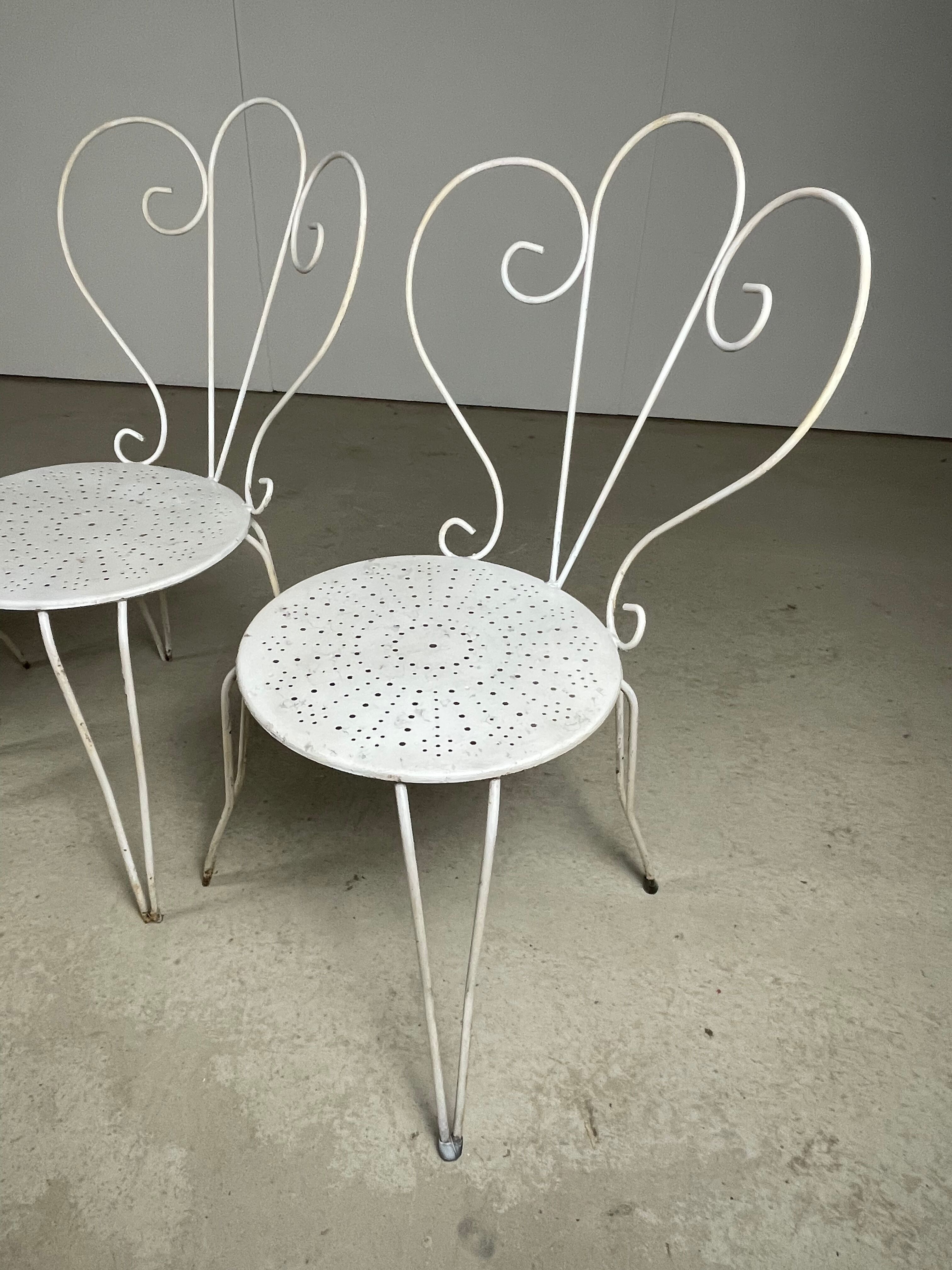 4 vintage wrought iron chairs