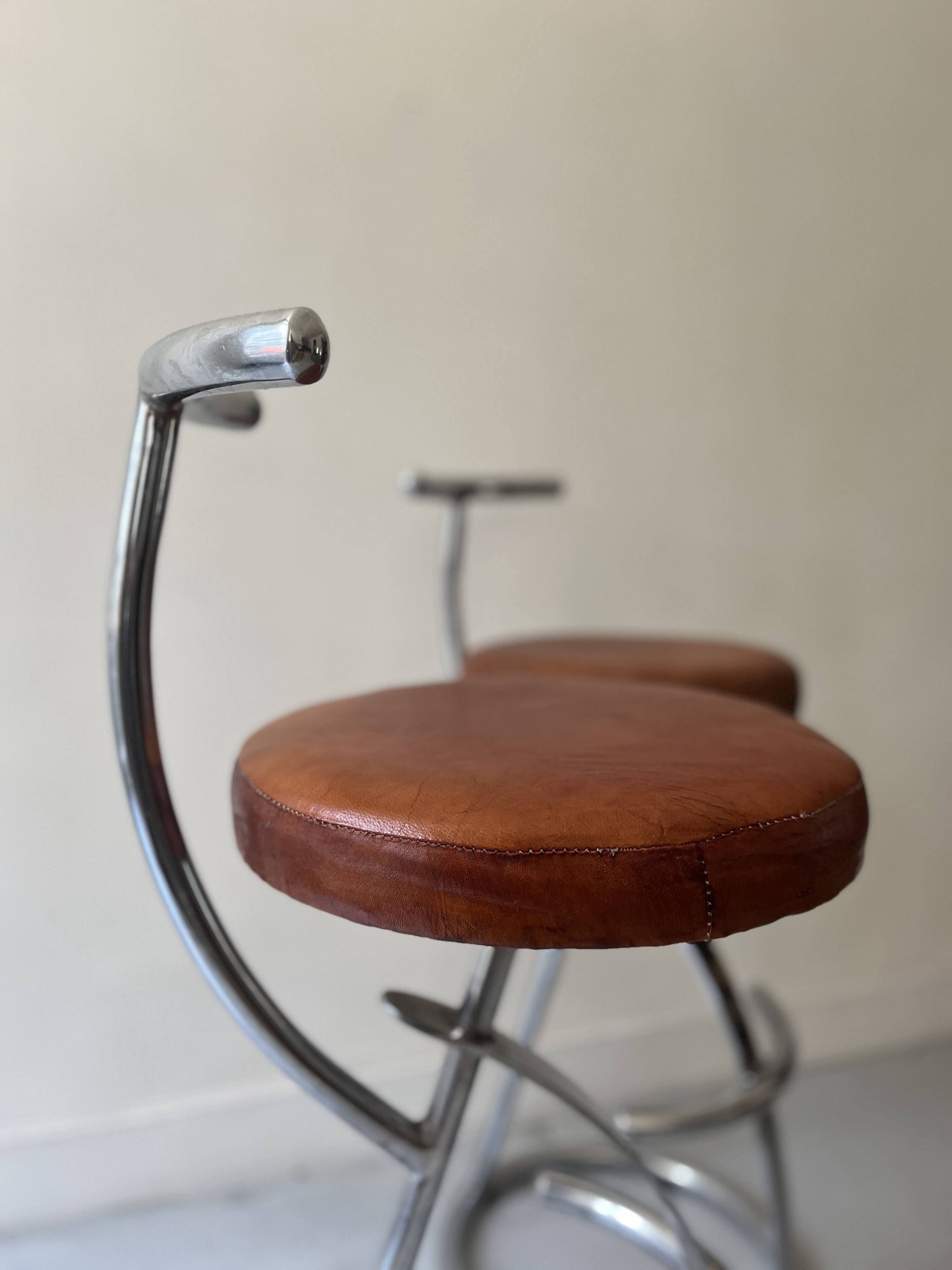 Bar stools in tubular chrome and tan leather, 1970s