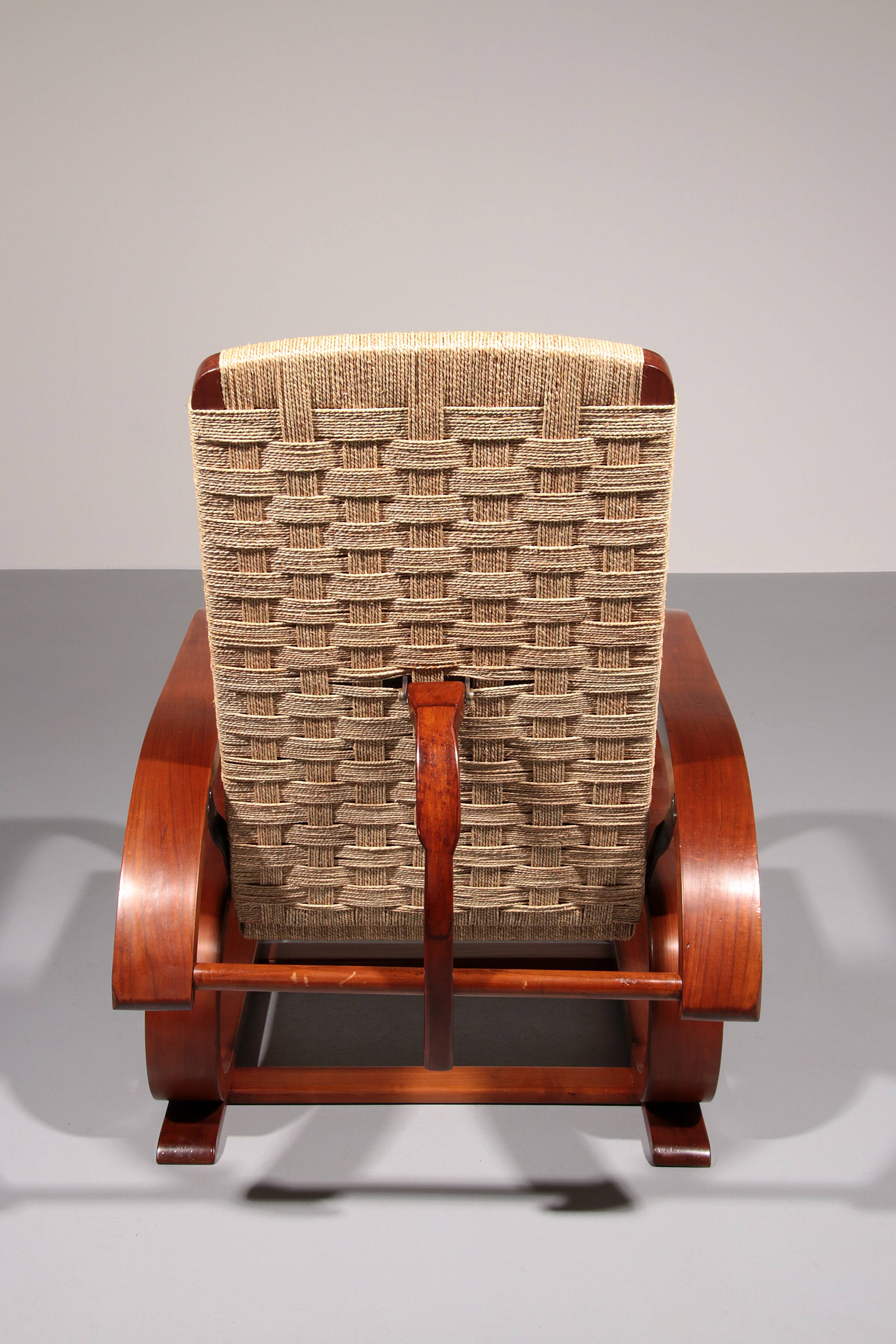 An exceptionally rare mahogany recliner crafted in Italy during the 1950s"